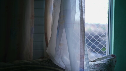 Apartment curtain window closeup with security net