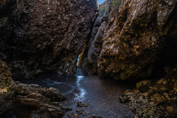 Fototapeta na wymiar Beautiful view of secret path between rocks in Nerja beach, Spain