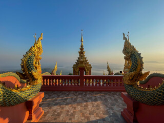 Fototapeta premium Beautiful landscape sunrise view point at Wat Doi Prachan Mae Tha Temple, Thailand. 