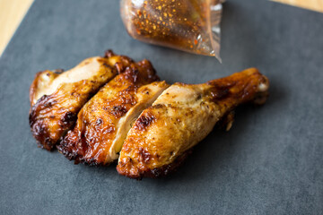 Chicken steak grilled on black plate