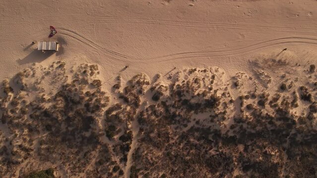 Panning aerial shot of sandy beach texture