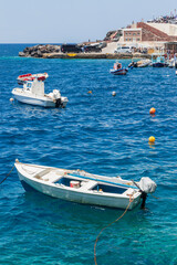 Santorin Greece. 06-11-2022. Fish boat at little harbor of Oia at Santorin Island. Cyclades Island....