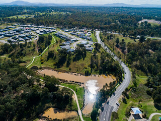 Nowlan park with Gardner circuit road going through it and a large dam in the waterway