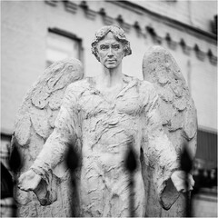 statue of archangel Michael. Archangel Michael Sculpture, The archangel isolated on white - obrazy, fototapety, plakaty