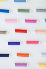 Fototapeta na wymiar Colorful thread spool background, close-up