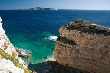 Looking south from the southern end of Paxos by Tripitos Arch to the island of Antipaxos, Ionian Islands, Greece