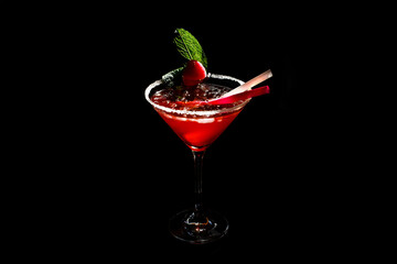 Glasses of delicious strawberry daiquiri on black background.