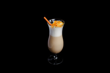 Irish coffee in glass on black background.