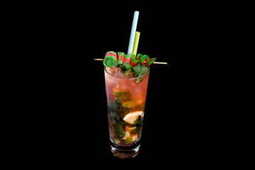 Alcoholic cocktail on a black background, decorated with a skewer with berries and straws.