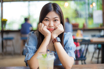 Beautiful asian women sitting in coffee shop