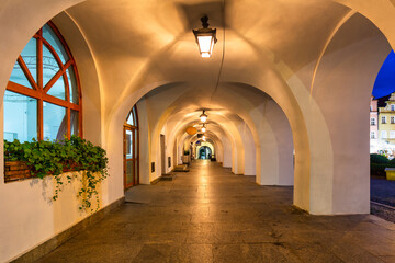 Fototapeta premium Beautiful architecture of the Town Hall Square in Jelenia Gora at dusk, Poland