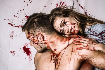 Couple in blood. Terrifying zombie couple. Fresh tasty beef. Zombie. - obrazy, fototapety, plakaty