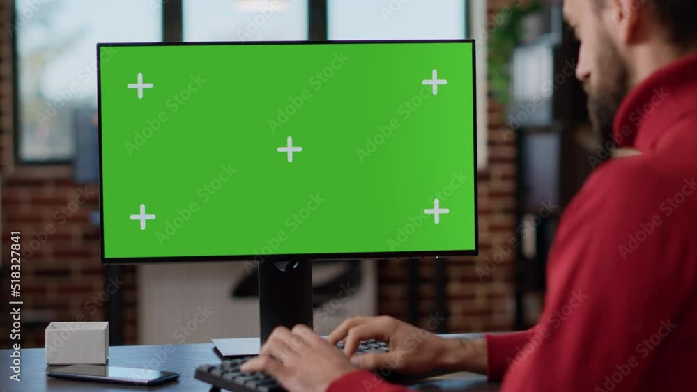Poster executive manager looking at monitor with green screen, using modern technology on computer. busines