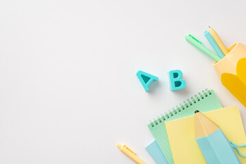 Back to school concept. Top view photo of school accessories plastic alphabet letters blue...
