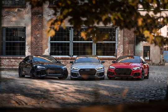 Wroclaw, Poland - October 3, 2020: Three Audi RS5 german cars parked in industrial environment