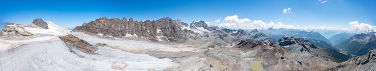 Panoramic aerial view of the Bernina group and glacier seen from Refuge Scerscen in Valmalenco, Italy, July 2022