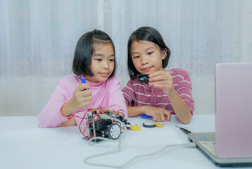 Children learning robotic education of technology in classroom