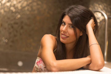 Portrait of a beautiful young woman in a luxury SPA.