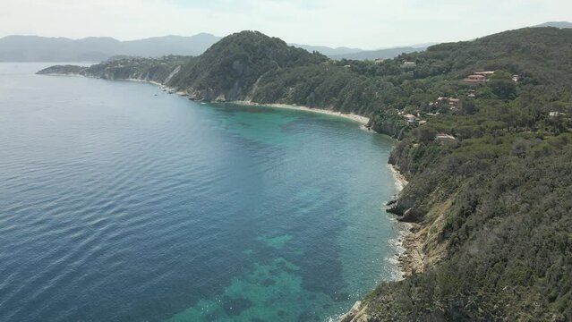 island of elba in italy mediterranean coast aerial images of the beach with turquoise blue waters, flight with drone european tourism