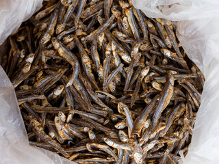 Sun dried dilis or anchovy inside a plastic bag at a dry fish market in the Philippines.