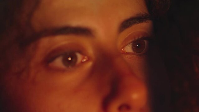close up portrait of mentally disturbed woman crossing her eyes looking at a flickering light