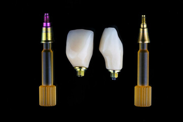 composition of two dental crowns and two abutments on screwdrivers