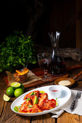 chicken wings with potato wedges and sezam.