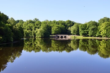 Obraz premium The peaceful reflecting lake in the countryside.