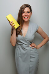 Teacher woman or student, business woman with yellow book isolated female portrait.