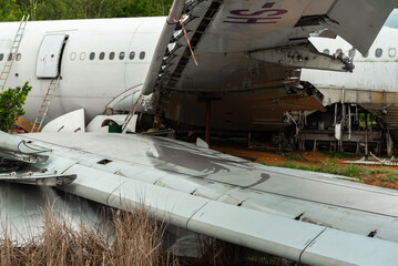 Airplane crash scene on the ground.