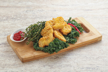 Crispy chicken nuggets with tomato ketchup