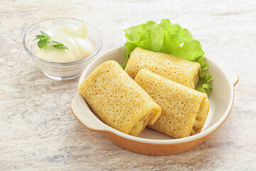 Stuffed pancakes with meat and cream