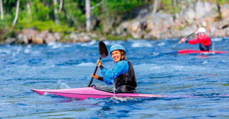 Portrait kayaker of smiling woman on kayak boat. Concept extreme water sport
