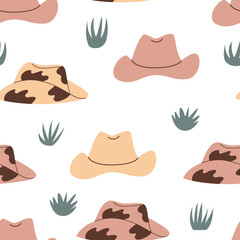 Seamless western pattern with cowboy hats and grass. Vector wild west background
