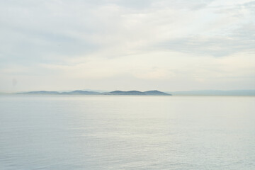 View of the sea and mountains in the fog