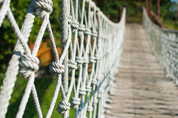 white rope bridge blur background