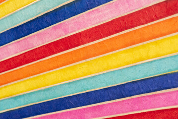 pattern background of colored or multi-colored diagonal stripes, in recycled material. Fiber textured paper.
