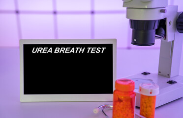 Medical tests and diagnostic procedures concept. Text on display in lab Urea Breath Test