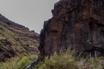 Panoramic view on El Dedo del Roque Pai crag, Roque Paez in the Anaga mountain range, Tenerife, Canary Islands, Spain, Europe. Scenic hiking trail from Afur to Taganana through canyon Barranco de Afur