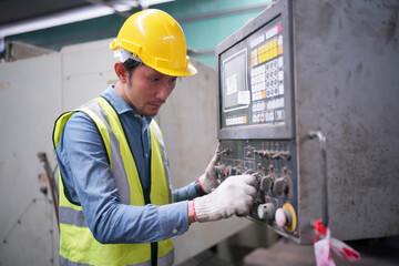 Portrait of a Professional Heavy Industry Engineer Worker Wearing Uniform, Glasses and Hard Hat in a Steel Factory. Industrial Specialist Standing in Metal Construction Facility.