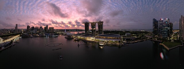 Fototapeta na wymiar Marina Bay, Singapore: Aerial View of The Picturesque Marina Bay Sands Casino and Hotel, The Shoppes, Singapore Flyer and the Art Museum