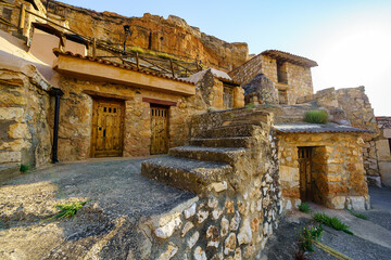 Cave houses dug into the rock of the mountain and used as wineries to make wine, San Esteban de Gormaz.