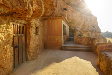 Cave houses dug into the rock of the mountain and used as wineries to make wine, San Esteban de...