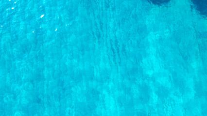 sea from a drone. Blue sea surface from above. Sea surface aerial view. The color of the water and beautifully bright. Aerial view of a crystal clear sea water texture