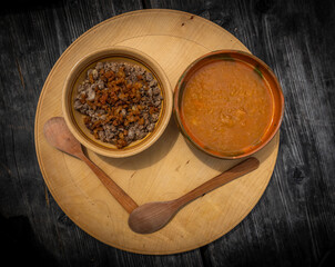 Zganci food national in Slovenia on wooden old table in nature of Velika Planina