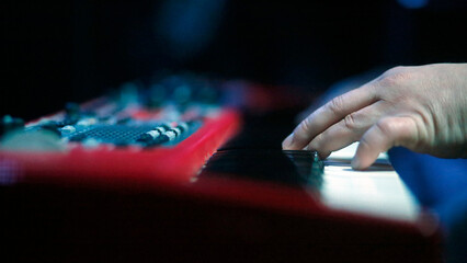 Fototapeta premium Closeup of a Musician Playing a Keyboard