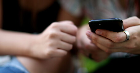 Close-up hands holding smartphone. People using cellphone