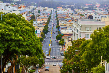 View on top of steep road in San Francisco overlooking neighborhoods