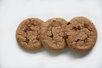 Oatmeal cookies with chocolate chips on a white background. Cookies are delicious close-up.
