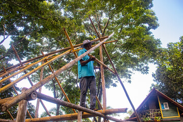 Men building a bamboo house